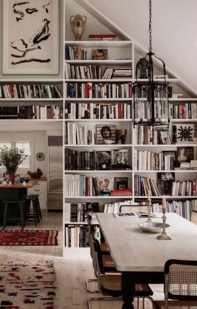 Framed Art Above Built-In Shelves Adds Personal Style
