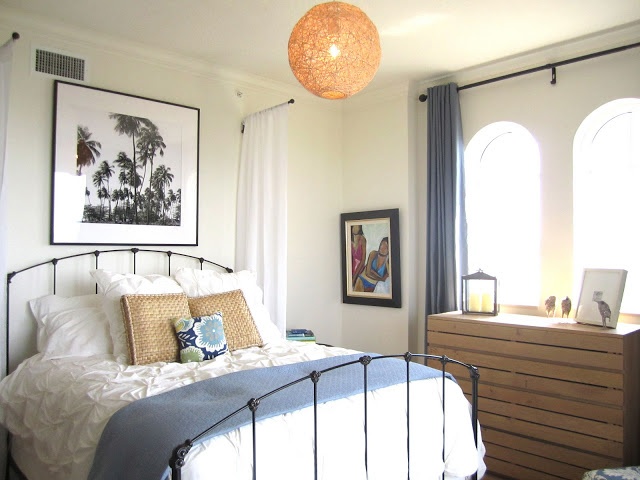 Large Framed Palm Tree Art Anchors a Coastal Bedroom
