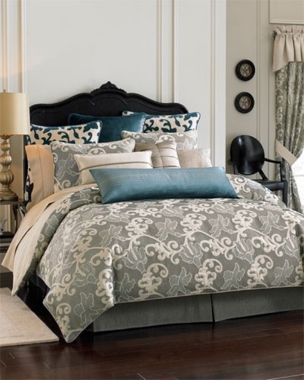 Ornate Black Headboard Anchors a Layered Pillow Display