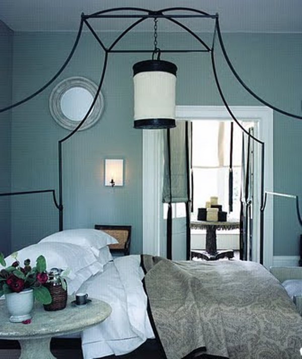 Ornate Canopy Bed Frame Creates a Dramatic Centerpiece