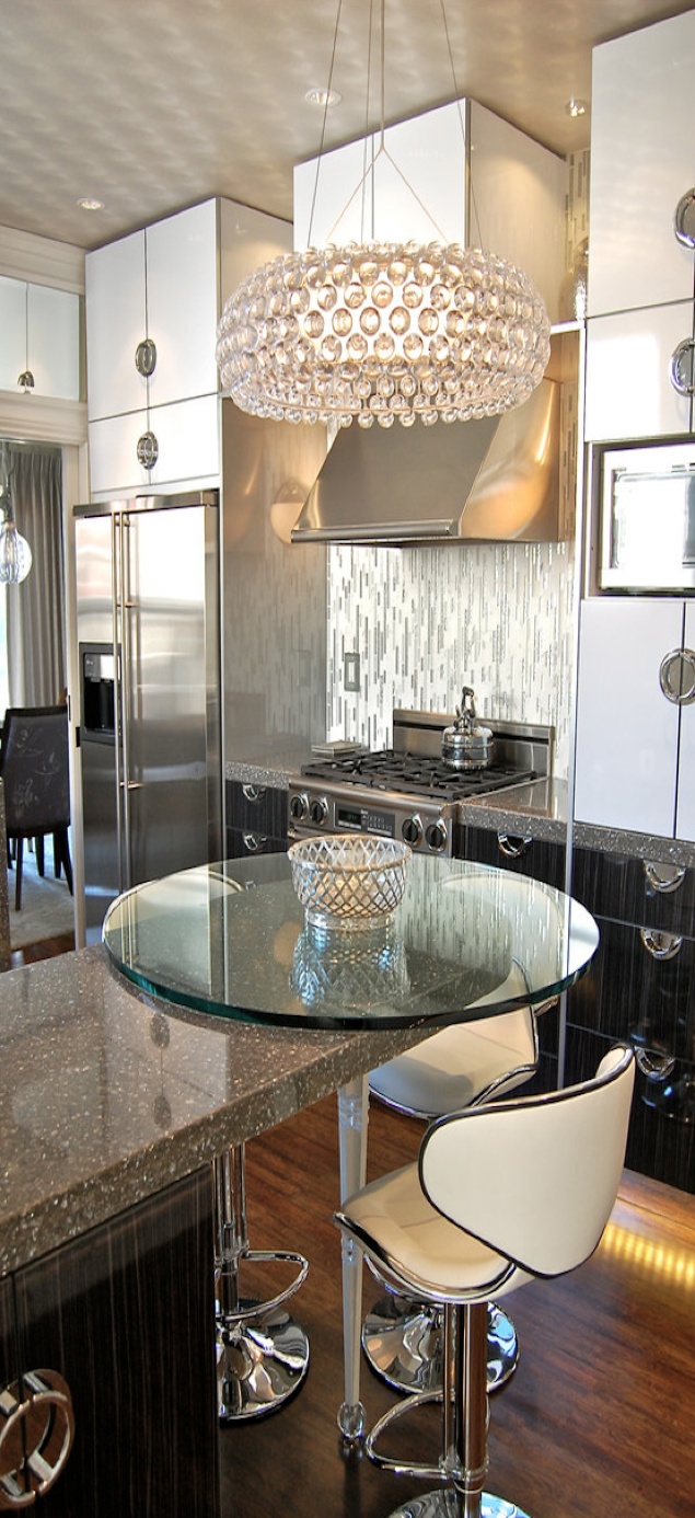 Oversized Crystal Chandelier Adds Dramatic Sparkle Over Island
