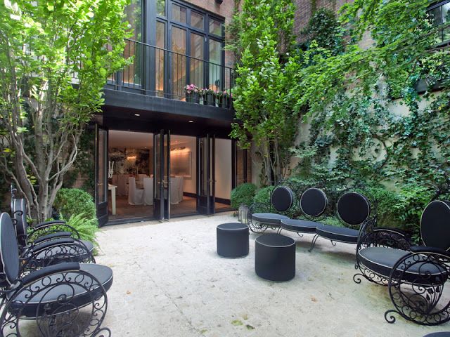 Black Upholstered Seating Creates A Modern Outdoor Lounge