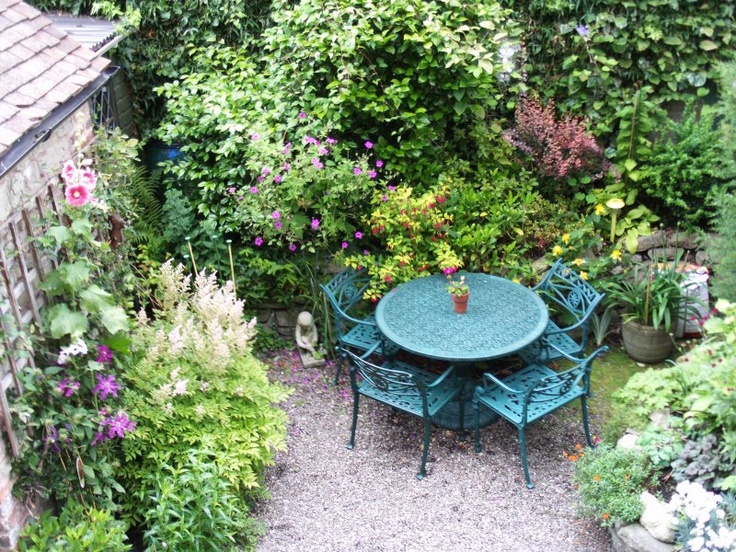 Anchor a Gravel Courtyard with a Cast Iron Dining Set