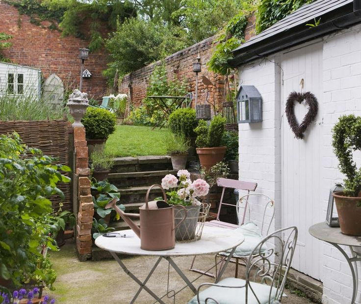 Distressed Metal Bistro Set Creates A Romantic Garden Corner