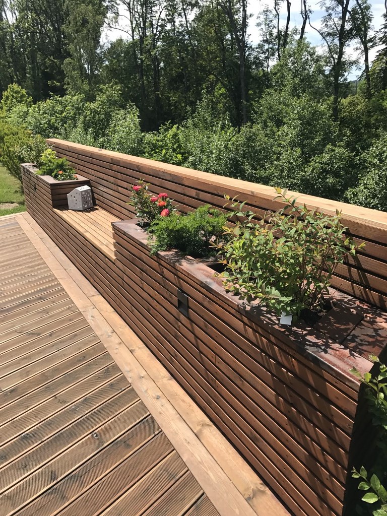 Wooden Planter Boxes Integrated Into a Decked Area