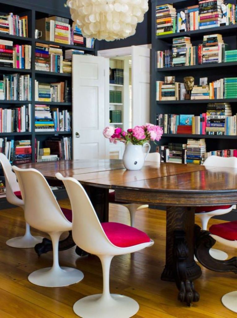 White Tulip Chairs With Bright Cushions Add Color