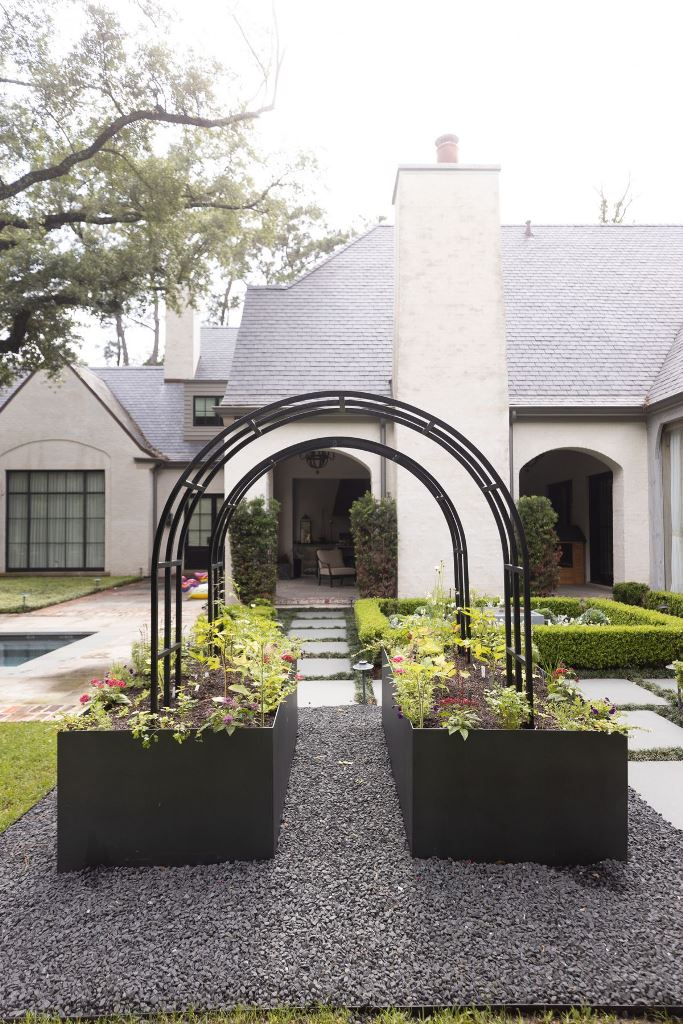 Black Arches Add Vertical Interest Above Planters