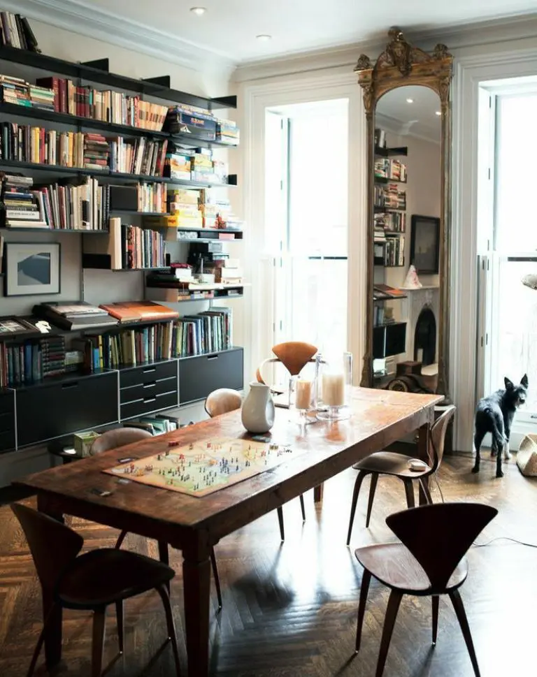 Ornate Mirror Reflects Bookshelves and Adds Grandeur