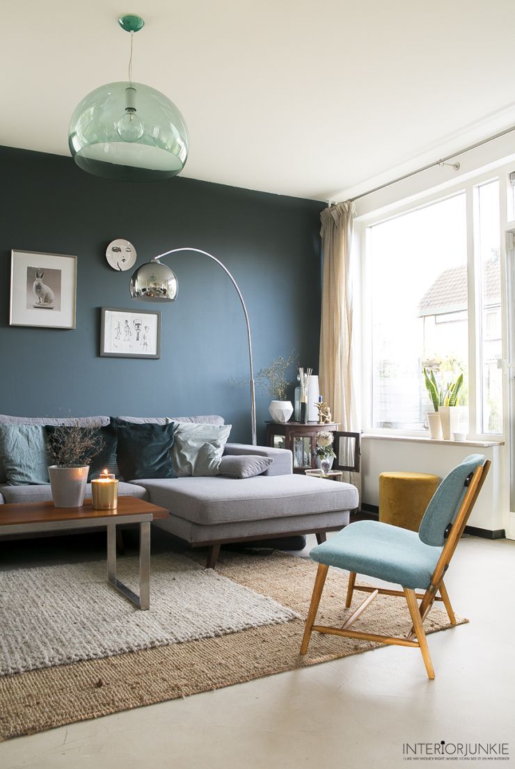 Arched Floor Lamp Adds Soft Light Over Sectional Sofa