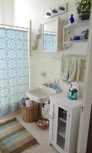 Turquoise Jar Holds Toothbrushes and Bathroom Tools