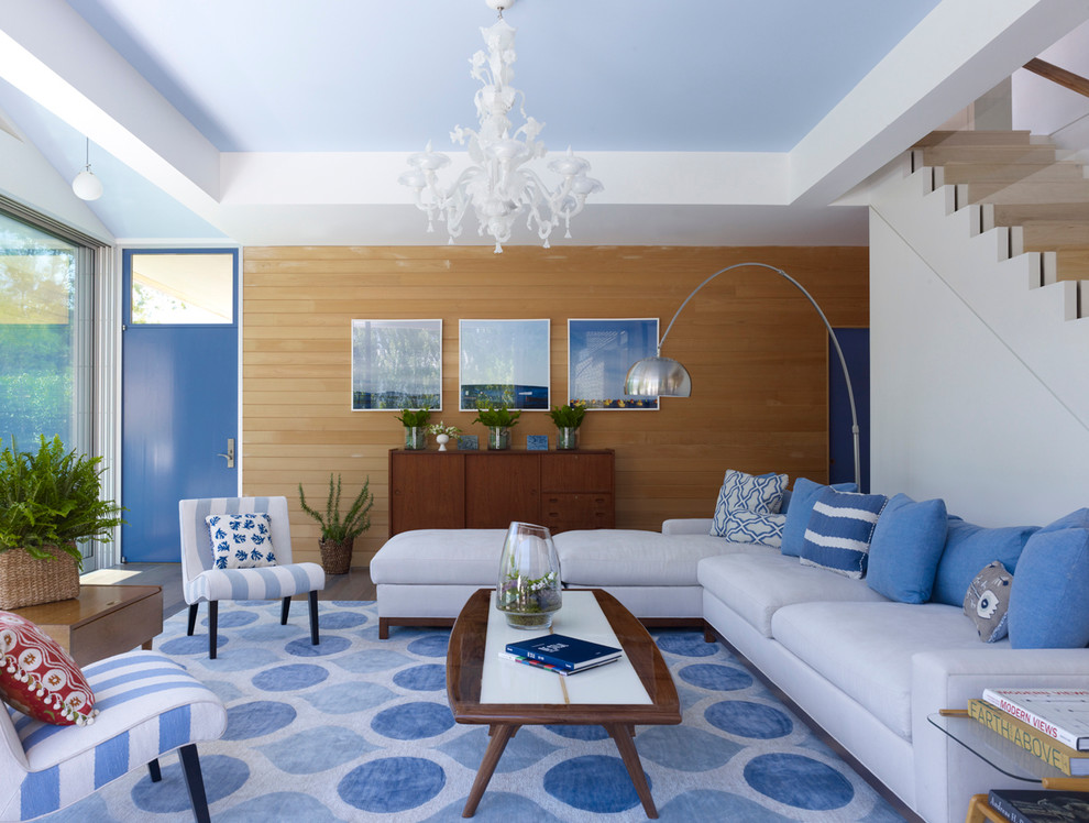 Warm Up Walls with Wood Paneling Behind Blue and White Accents