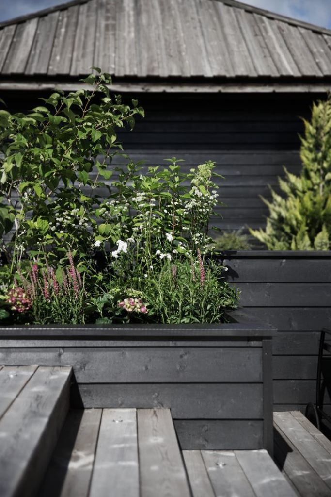 Grounded Feel with Dark Horizontal Planters and Mixed Blooms