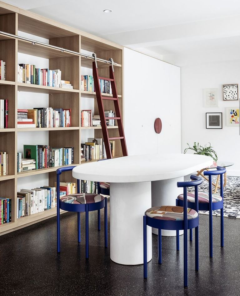 Red Rolling Ladder Grants Access to High Bookshelves