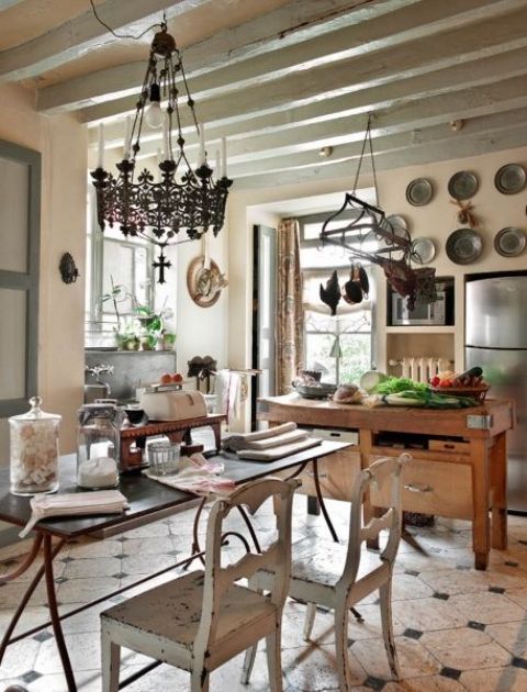 Ornate Chandelier Illuminates Rustic Kitchen Beams