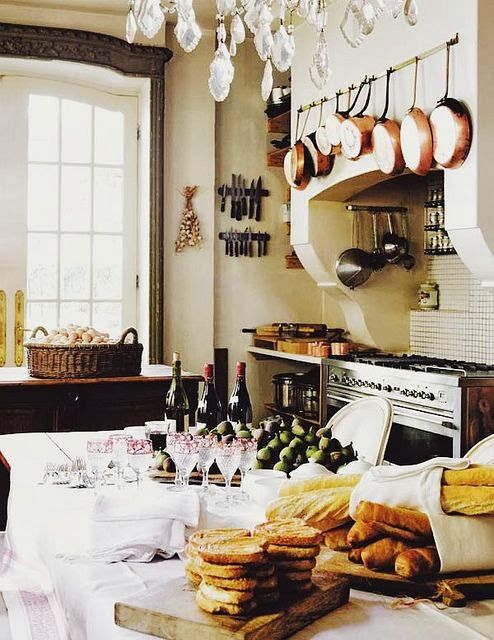 Copper Pots Hung Above the Stove Add Warmth