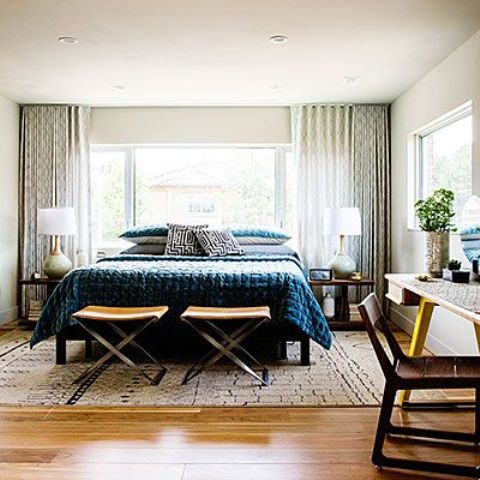 Cross-Legged Stools Offer Flexible Seating at Foot of Bed