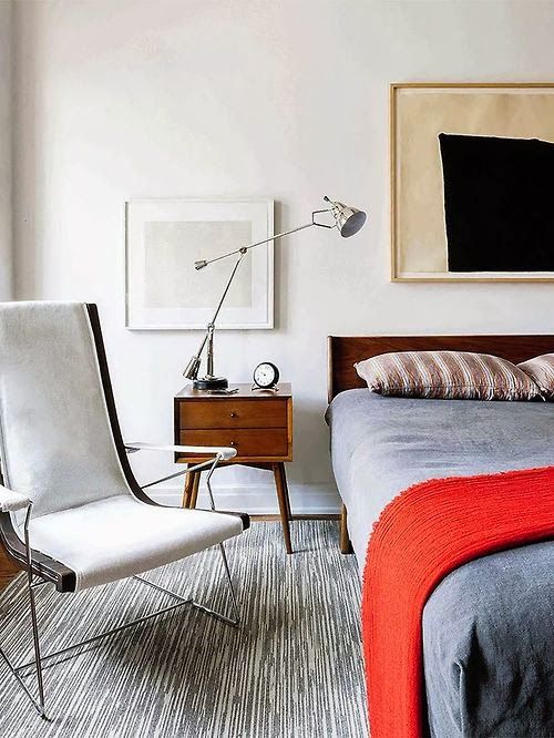 Introduce Bold Contrast with Abstract Art Above the Bed