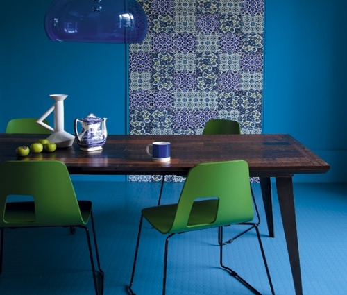 Bold Patterned Wallpaper Anchors a Jewel-Toned Dining Room