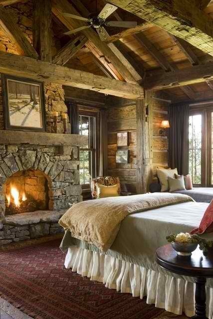 Stone Fireplace With Natural Wood Beams Creates a Cozy Focal Point