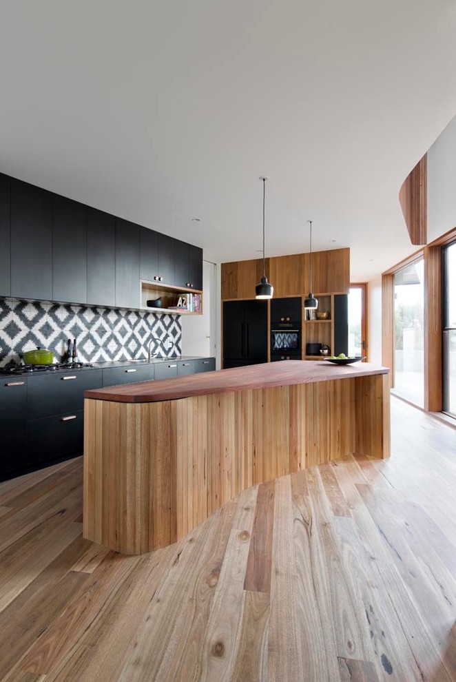 Curved Wood Island with Integrated Seating Area