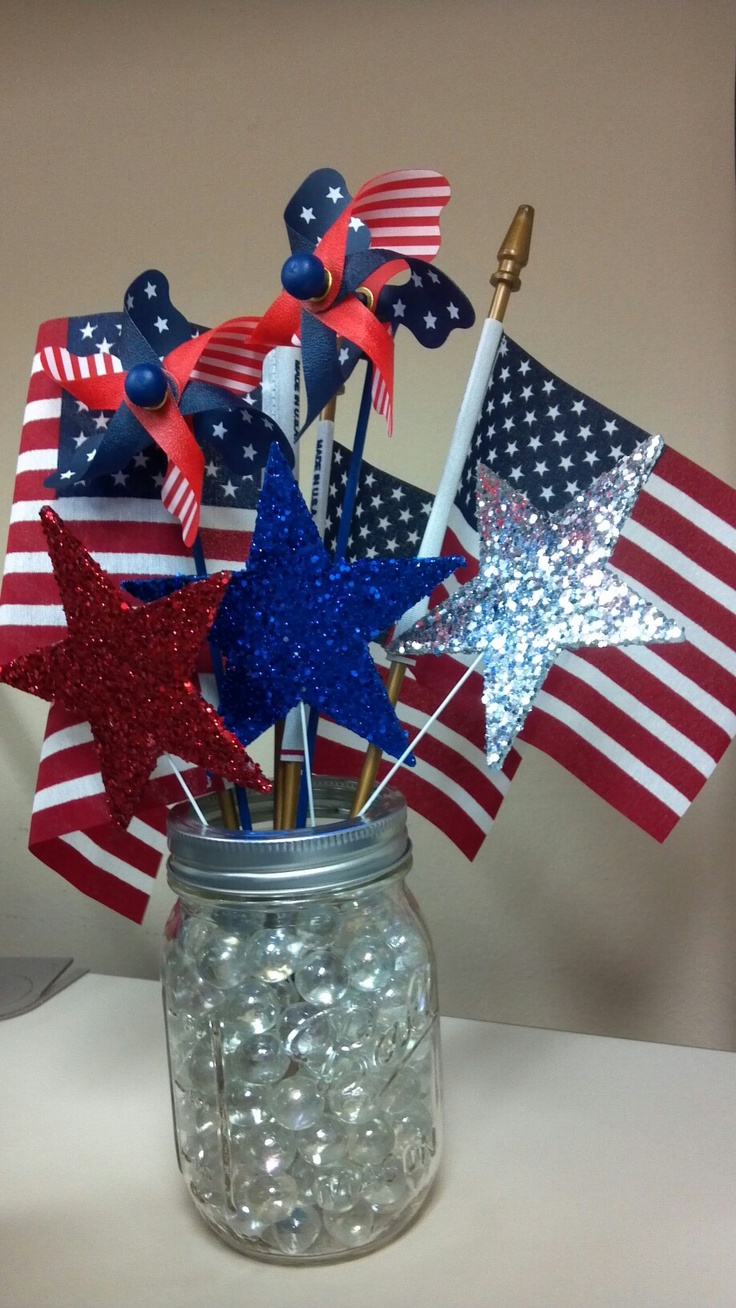 Mason Jar Filled With Marbles Holds Patriotic Pinwheels and Stars