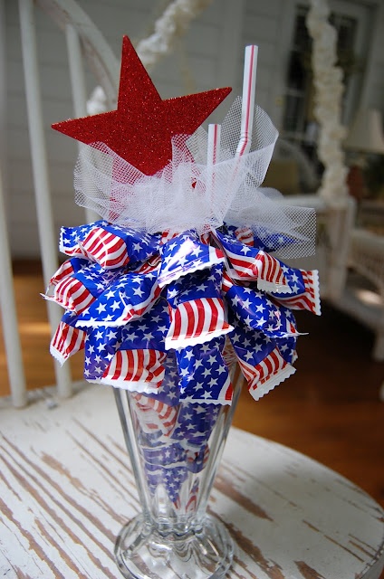 Tall Glass Holds Wrapped Treats Topped With Glitter Star