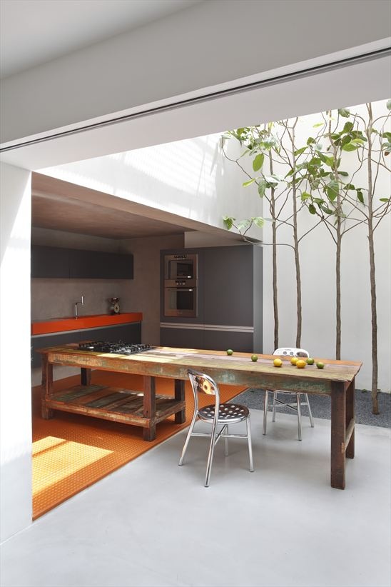 Reclaimed Wood Table Anchors Open-Air Kitchen