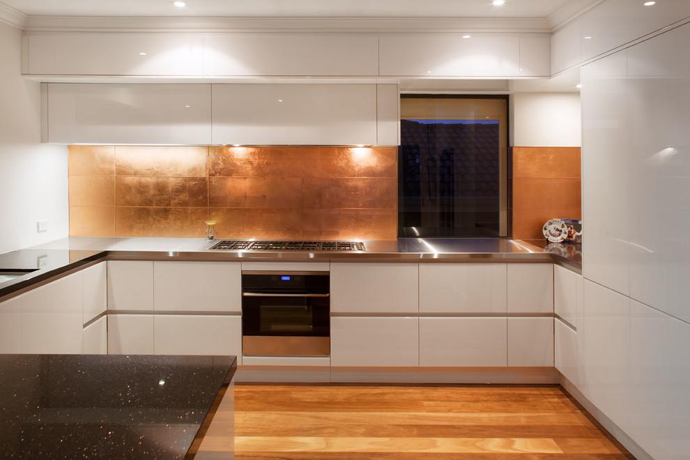 Copper Leaf Tiles Add Organic Texture To Kitchen Backsplash