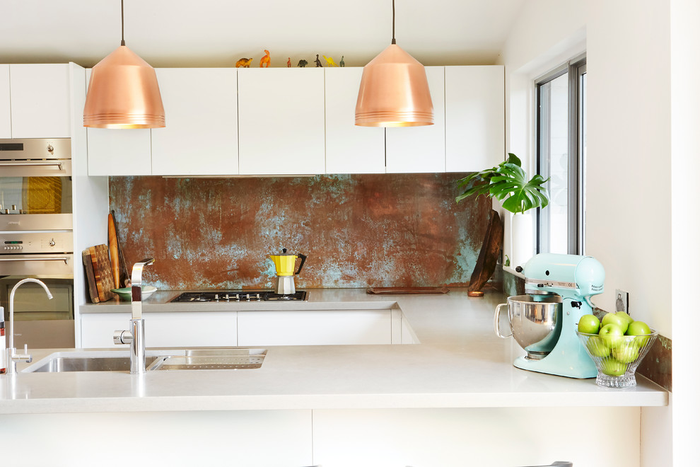 Distressed Copper Backsplash Adds Patina Behind Stove