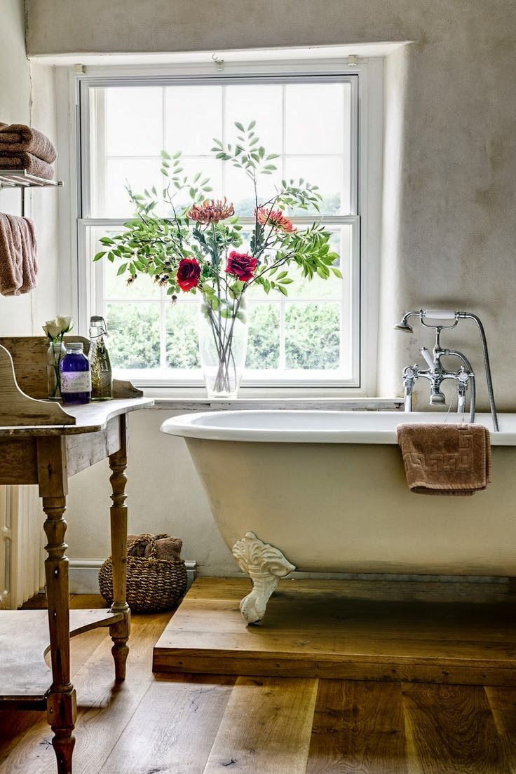 Tall Vase of Flowers Adds a Natural Focal Point to the Window