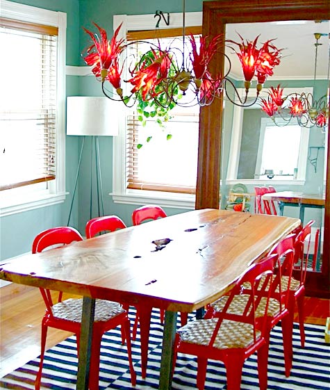 Bold Color with Red Chairs Around a Live-Edge Table