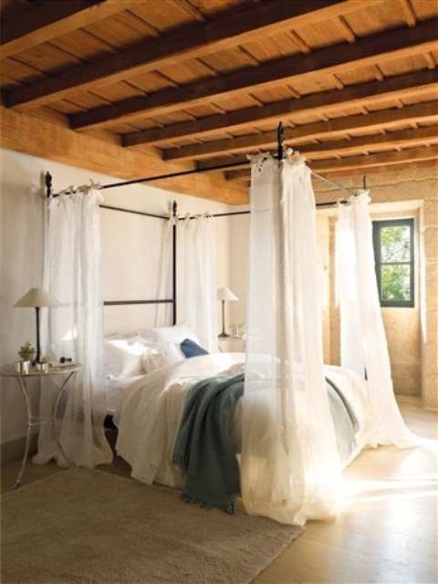 Four-Poster Bed With Sheer Drapes For Softness