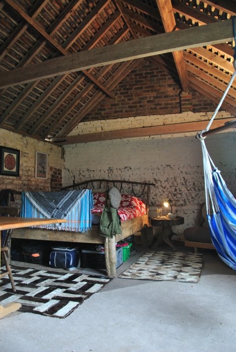Hammock Hung From Ceiling Beam Adds Casual Seating