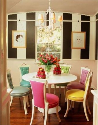 Pastel Upholstered Chairs Add a Playful Touch Around a White Table