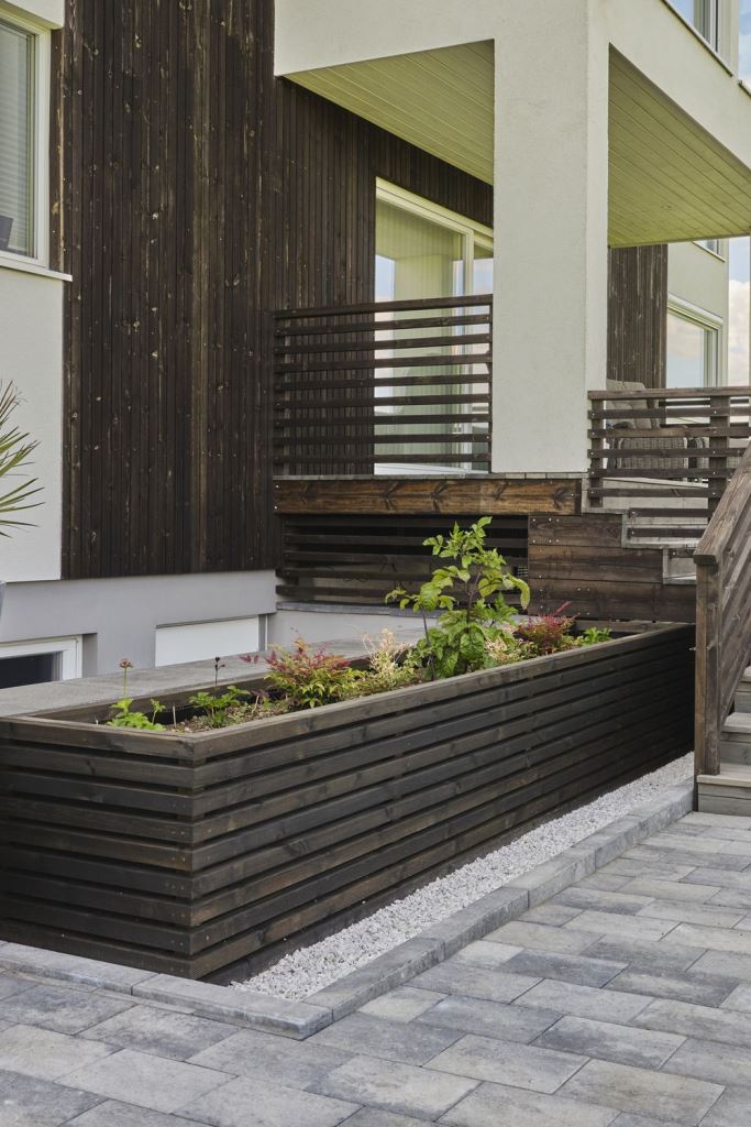Dark Stained Wood Planter With Horizontal Slats