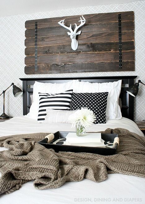 Dark Wood Plank Headboard With Mounted Antlers
