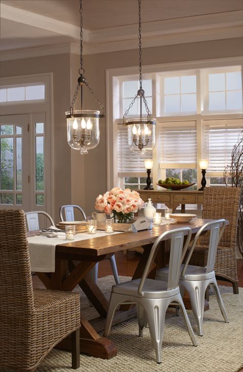 Glass Bell Jar Lanterns Add Warm Ambiance Over Dining Table