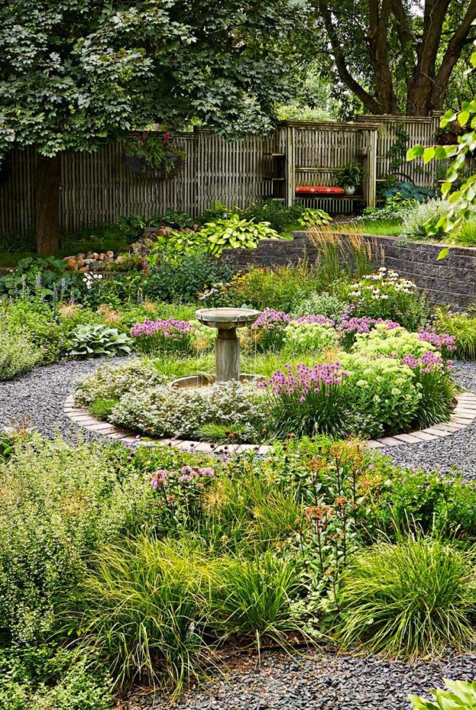 Bird Bath Anchors a Layered Flower Bed