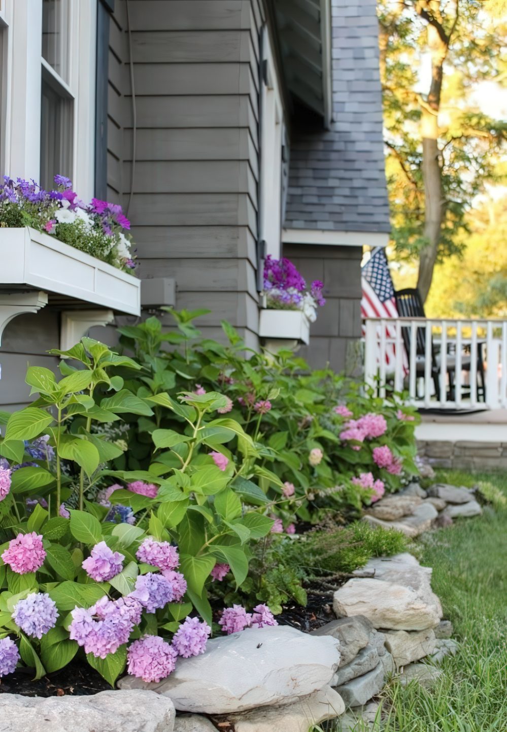 White Window Boxes Overflowing With Purple and Pink Flowers