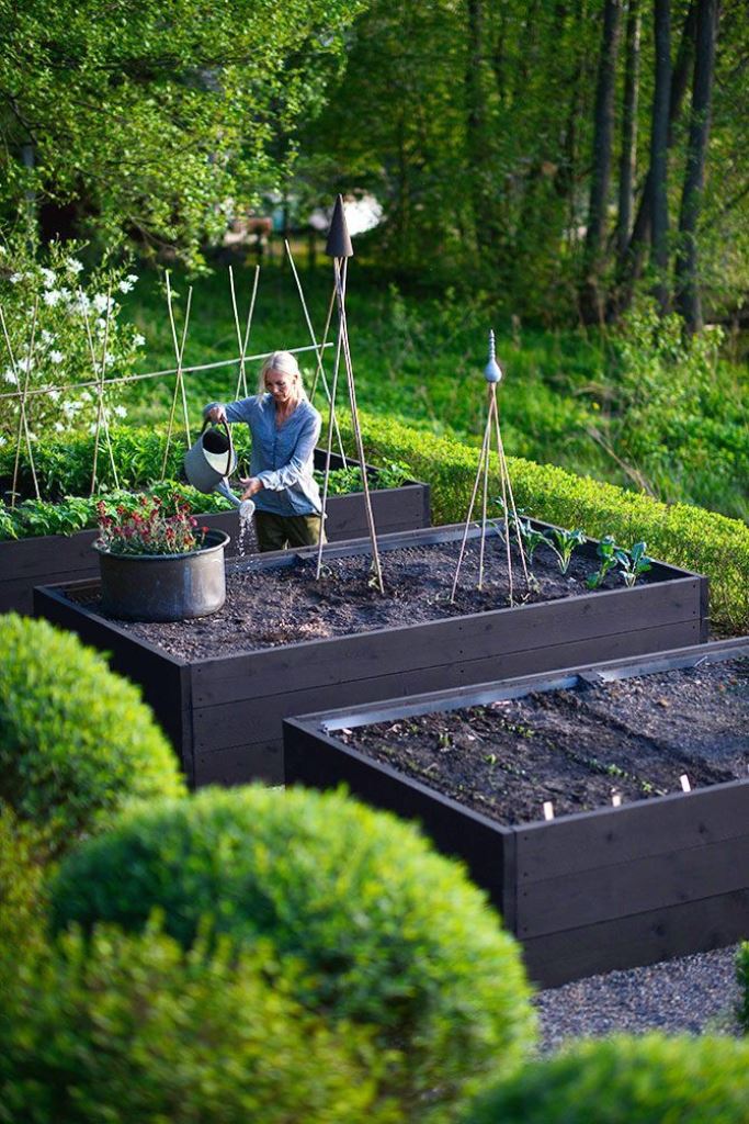 Define Garden Levels with Dark Wooden Planters