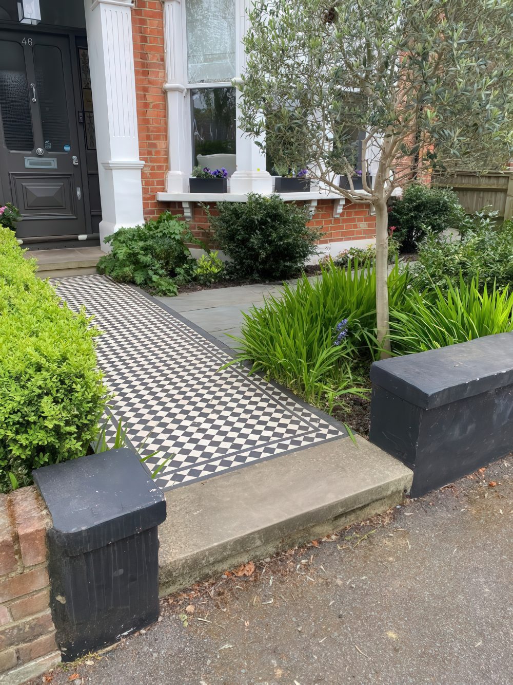 Checkerboard Path With Stone Planter Borders