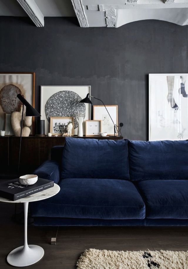 Layered Gallery Wall Adds Depth with Art and Sculptural Forms