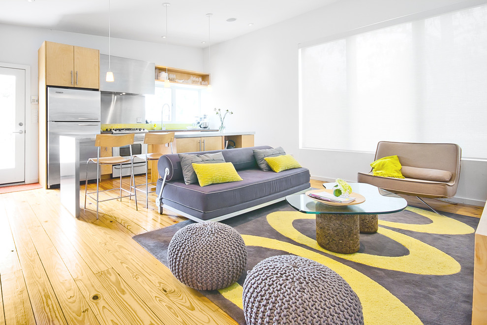 Round Knit Poufs Add Soft Texture to a Grey and Yellow Rug