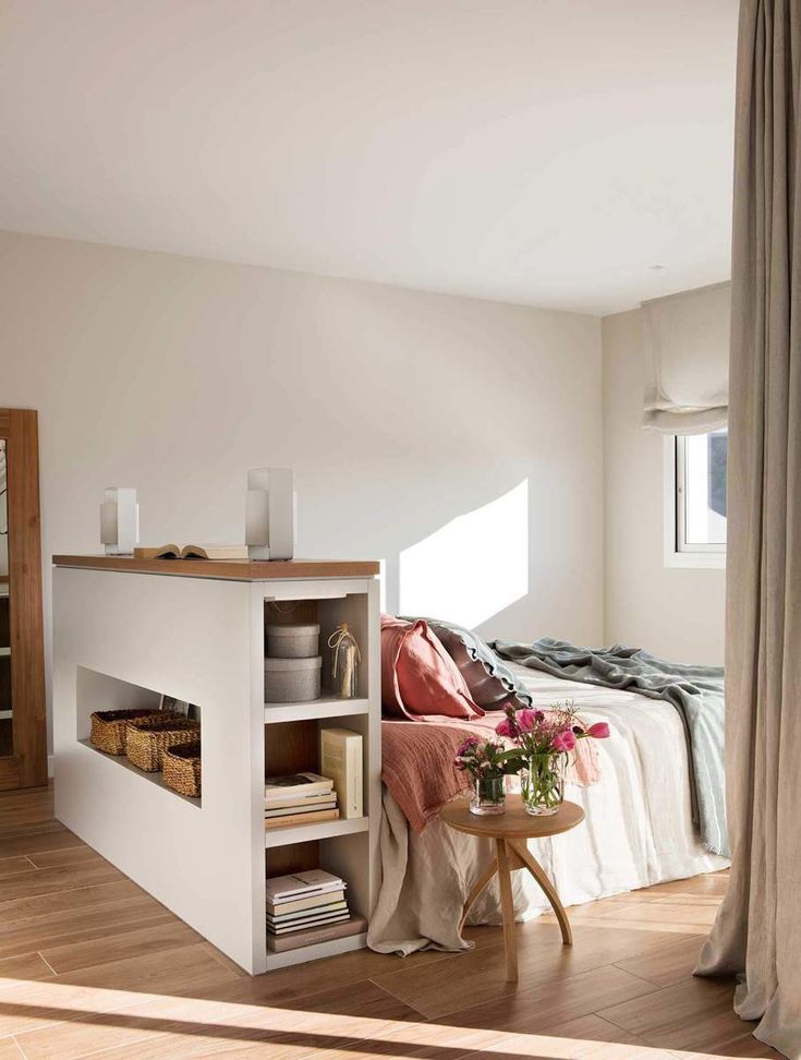 White Storage Unit With Horizontal Baskets and Vertical Shelves