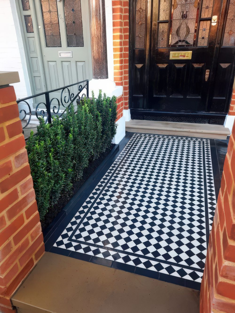 Black and White Checkerboard Tile Path for Entryway