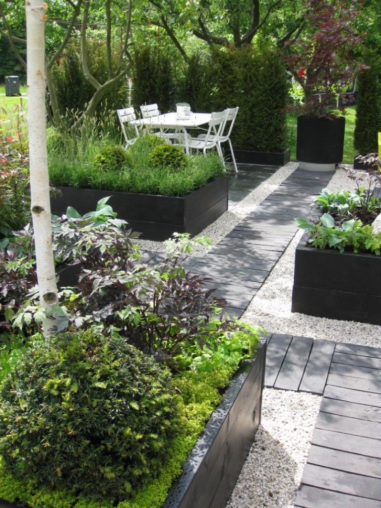 Bold Greenery Pops Against Deep Black Beds