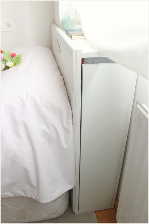 Tall, Slim Cabinet Integrated Into Headboard