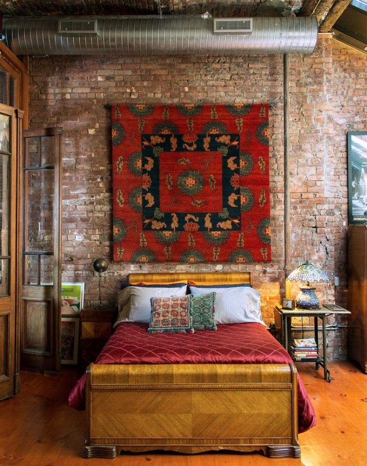 Large Textile Art Adds Bold Color Above Bed