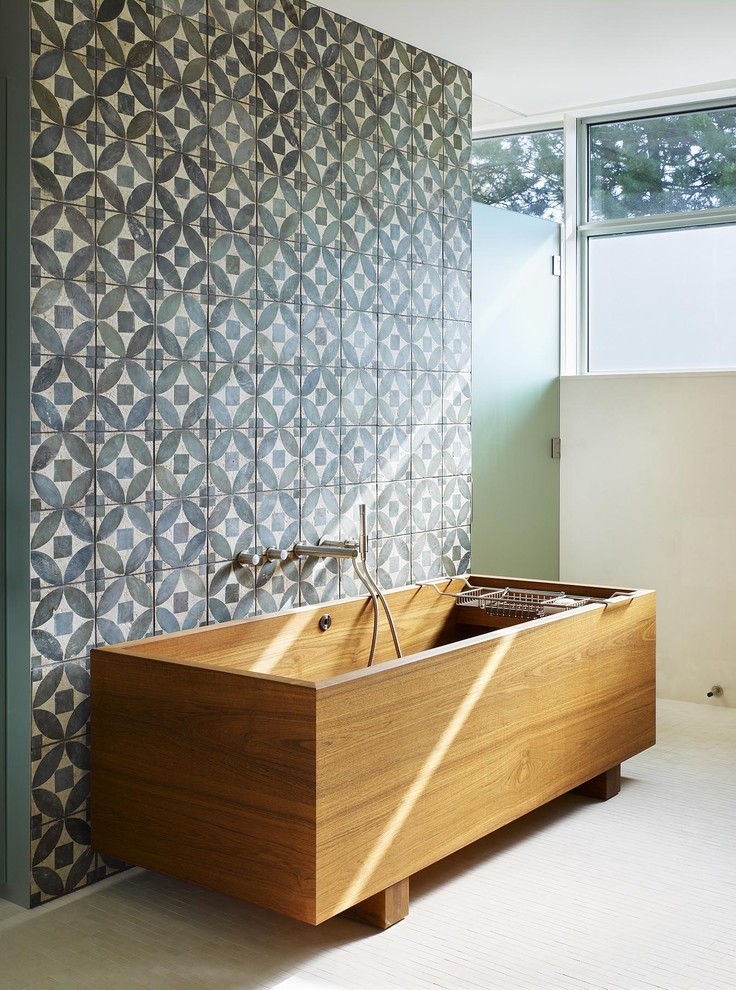Contrast a Wooden Tub with a Geometric Tile Wall