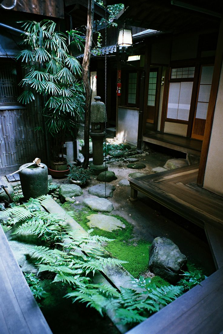 Stone Lanterns Add Vertical Interest to Mossy Gardens